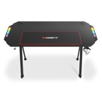 Drift DRDZ175RGB Ergonomía superiorSu compacto tamaño de 130 x 60 x 75 cm le permite adaptarse a cualquier espacio sin ninguna dificultad. Drift DZ175 es un escritorio gaming construido en materiales de alta calidad que aporta una gran firmeza. Su tablero laminado con fibra de carbono, es agradable al tacto y la hace resistente a líquidos y posibles ralladuras.Iluminación RGBSu increíble iluminación RGB, incluida en ambos laterales, realza el color oscuro del tablero. La estética de la mesa gamer DZ175 invita a sumergirse en cada partida y experimentar otro nivel de juego. Cambia los colores de la iluminación y crea tu propio tablero de juego.Luz reactivaAsimismo, la DZ175 incorpora una función reactiva, es decir, la iluminación de esta mesa gaming varía en función del sonido, iluminándose de una manera u otra según a la música o el sonido que proporcionen tus altavoces.Juega con los colores según el estilo que más se adapte a ti, podrás dejar un color fijo, eligiendo entre: azul, rojo, verde, violeta, cyan y amarillo, en cambio en el modo reactivo podrás escoger entre 6 modos diferentes de movimientos y 4 modelos de transición multicolor.AlfombrillaEfectúa cada movimiento con precisión gracias a la alfombrilla lavable de 80 x 30 cm, no habrá arena o pantalla que se te resista para hacerte con la preciada victoria.Soporte para bebida...Mantén la hidratación mientras juegas cómodamente y sin miedo a que ningún líquido se derrame haciéndote perder la partida. La DZ175 integra un portabebidas, para latas o vasos. No interrumpas la partida para recobrar fuerzas, ten tu refresco favorito a mano, evitando temidos accidentes, sobreviviendo en las largas sesiones nocturnas de juego.... ¡y auriculares!Además, la Drift DZ175 cuenta también con un soporte para reposar tus auriculares, optimizando el espacio, pudiendo colocar en su superficie todos tus periféricos de manera organizada.Altura regulableCon su robusta estructura podrás adaptar la altura de esta mesa gamer hasta un máximo de 75 cm, gracias a sus resistentes patas. Sus patas traseras incluyen además una rosca que permite regularla para adaptarse al desnivel que pueda tener el suelo.Estabilidad y resistenciaLa estabilidad está asegurada en esta mesa gaming que soporta un peso de 100 kilos: aguantando las batallas que parecen más imposibles.DZ175 es, además del mejor escritorio para gamers, sobre todo para todos aquellos que necesitan de una superficie sólida capaz de sostener equipos pesados para realizar las tareas de su día a día.Fácil montajeDZ175 es muy fácil de montar. Podrás armar esta espaciosa mesa en cuestión de unos pocos pasos y de manera muy sencilla. También incorpora un organizador de cables, haciendo un uso más eficiente del espacio, ayudándote a mejorar el rendimiento, permitiéndote centrarte en lo que realmente importa: el fulgor de la partida.